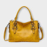 Lora. – Elegante bolso con correas