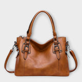 Lora. – Elegante bolso con correas