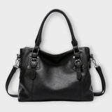 Lora. – Elegante bolso con correas