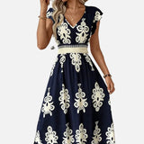 Candela - Vestido maxi barroco con escote en V